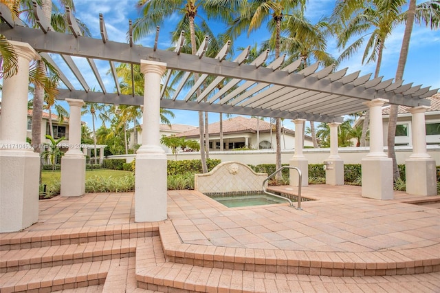 834 E Spinnaker Dr E, Hollywood, FL 33019 - view of patio featuring an in ground hot tub and a pergola