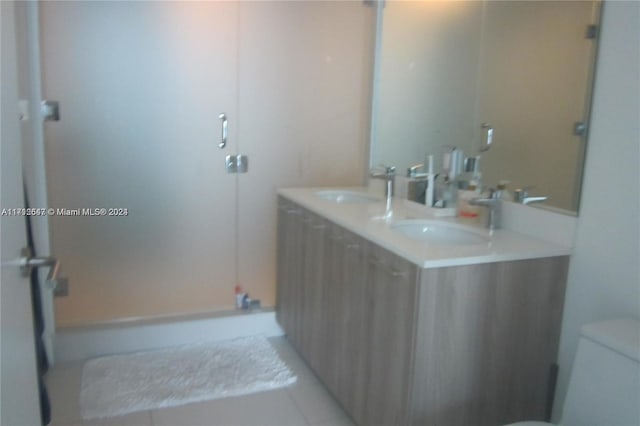 bathroom featuring tile patterned floors, vanity, and toilet