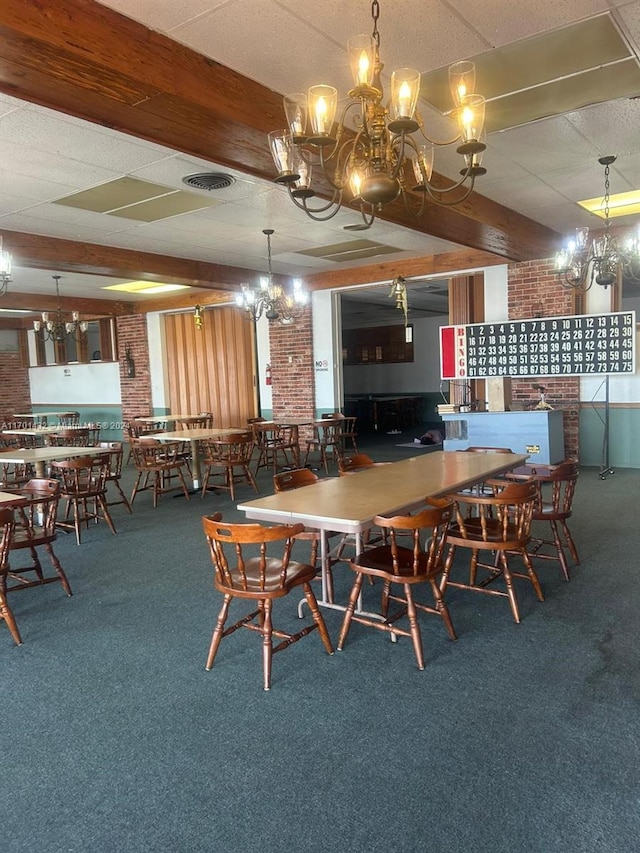 carpeted dining space featuring brick wall