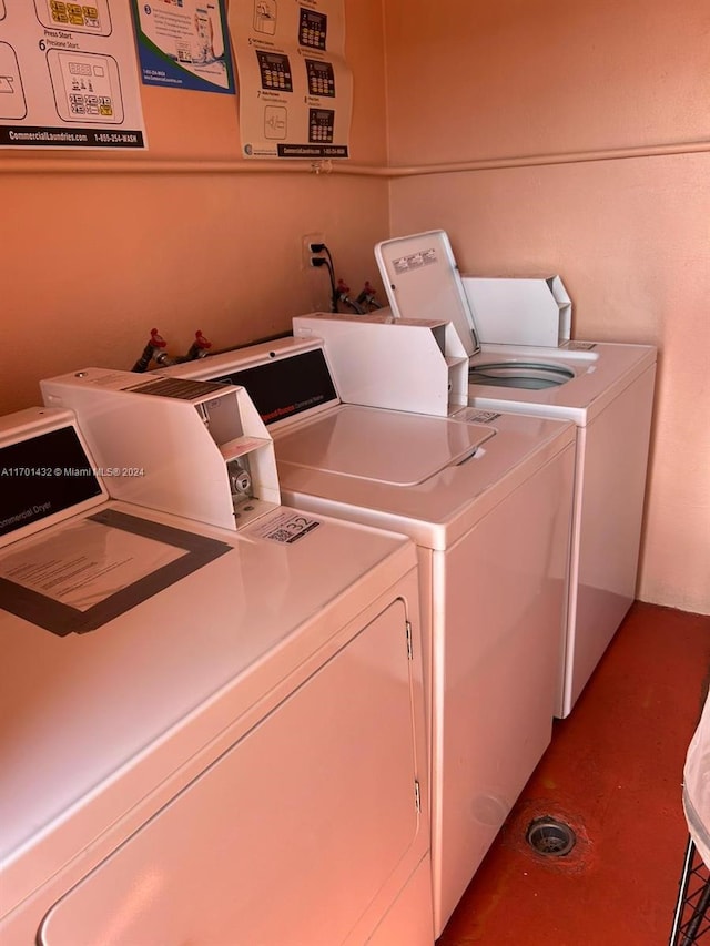 laundry area with independent washer and dryer