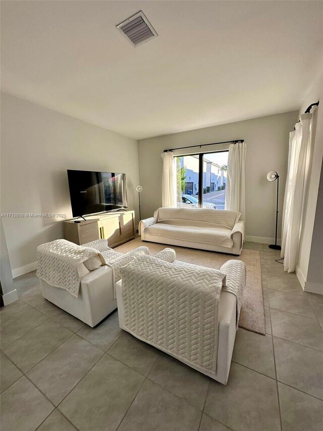 living room featuring light tile patterned flooring