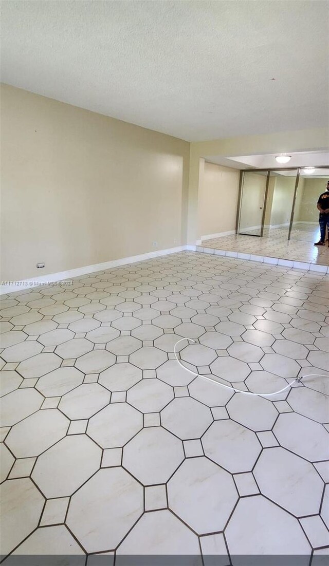 empty room with a textured ceiling