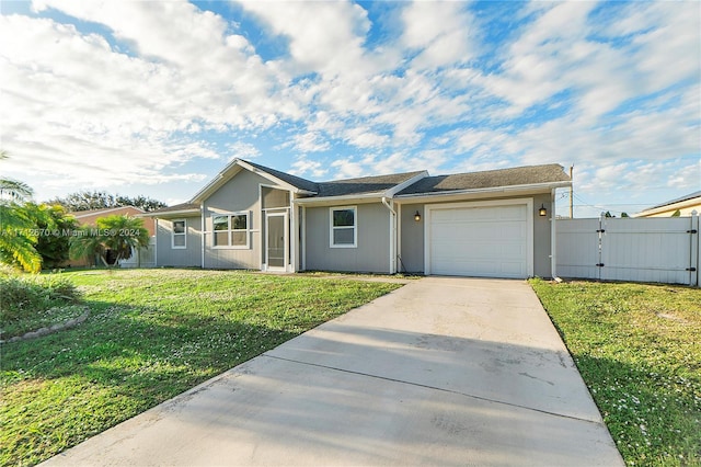 view of front of property with a front lawn and a garage