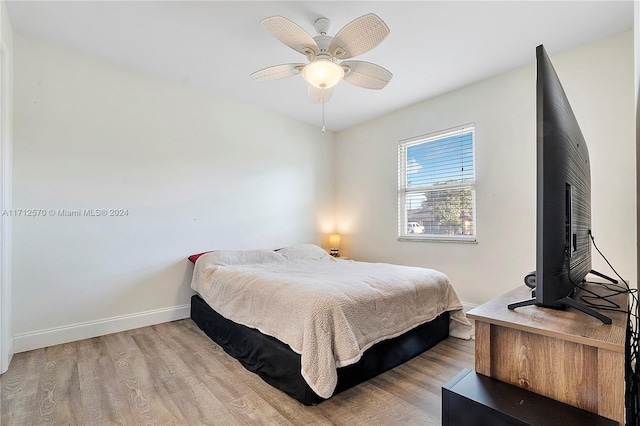 bedroom featuring light wood-type flooring and ceiling fan