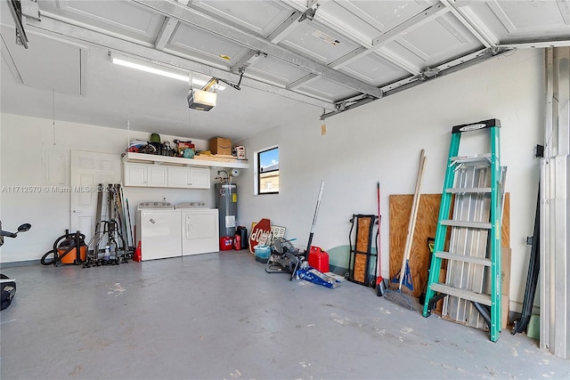 garage with water heater, washer and clothes dryer, and a garage door opener