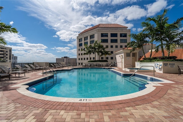 view of swimming pool featuring a patio area