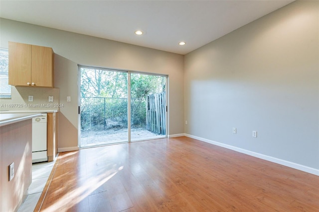 unfurnished living room with light hardwood / wood-style floors