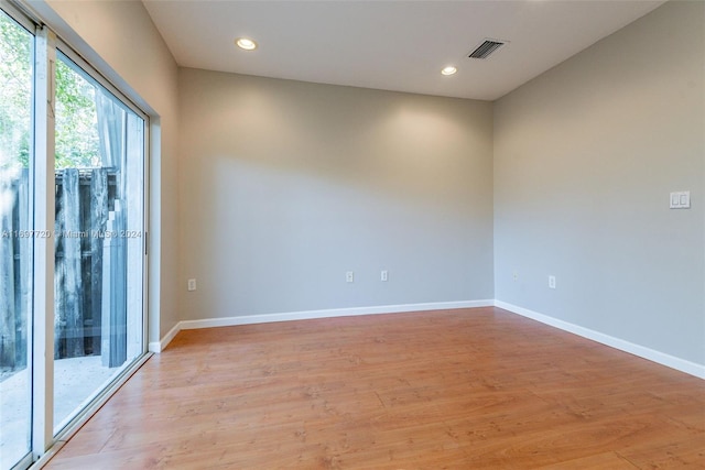 unfurnished room featuring light hardwood / wood-style flooring