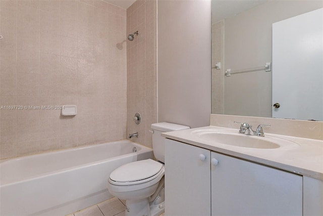 full bathroom featuring tile patterned floors, vanity, tiled shower / bath, and toilet