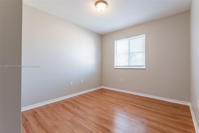 spare room featuring light hardwood / wood-style flooring