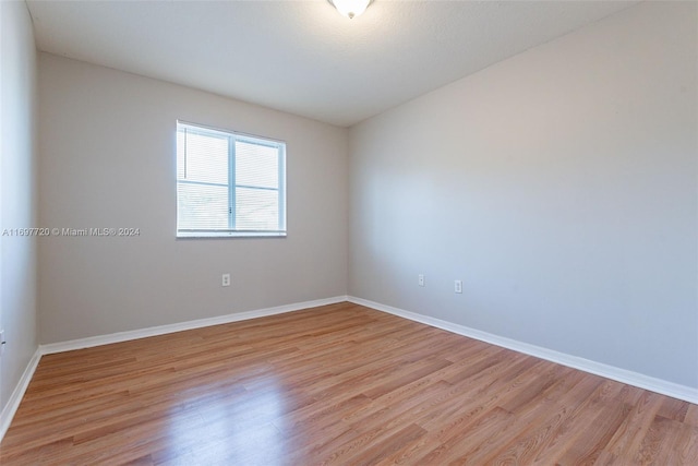 spare room featuring light hardwood / wood-style flooring