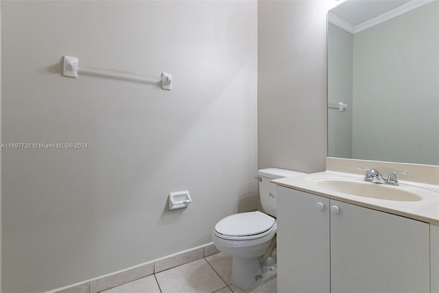 bathroom featuring vanity, toilet, tile patterned flooring, and ornamental molding