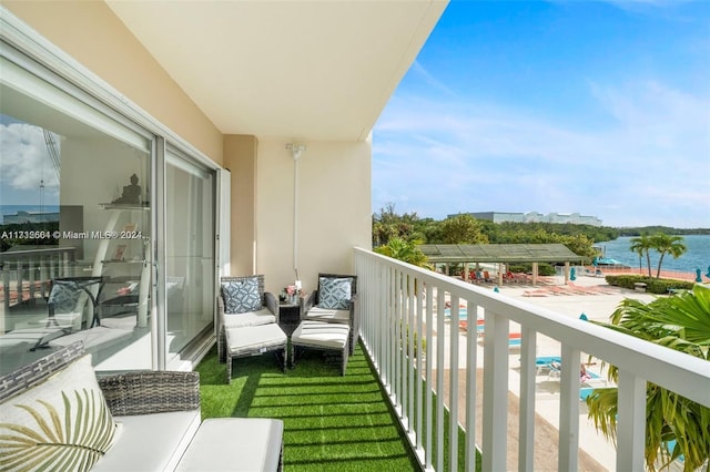 balcony featuring a water view