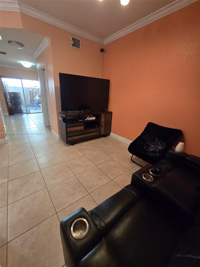 living room with ornamental molding and light tile patterned floors