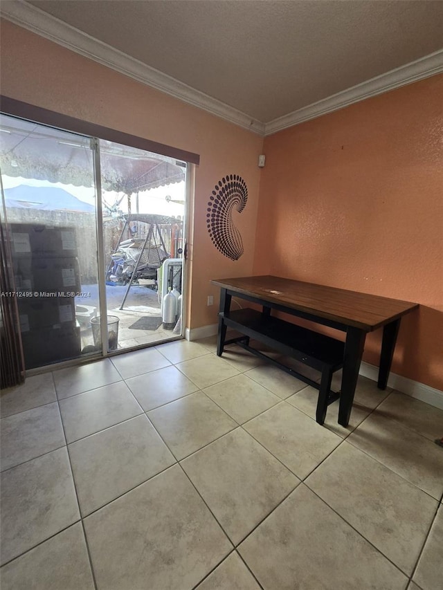 unfurnished dining area with crown molding and light tile patterned floors