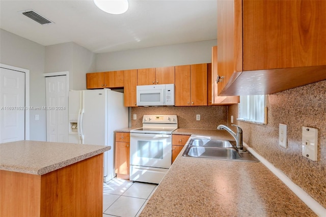 kitchen featuring light tile patterned floors, white appliances, backsplash, and sink