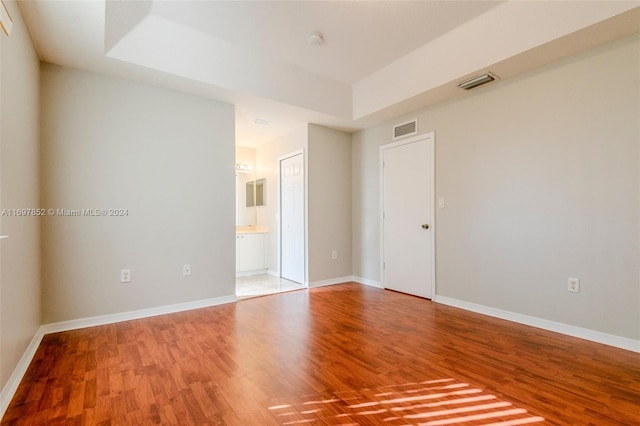unfurnished room featuring wood-type flooring