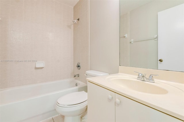 full bathroom with tile patterned flooring, vanity, toilet, and tiled shower / bath