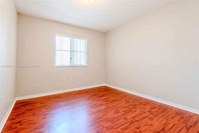 empty room featuring hardwood / wood-style flooring
