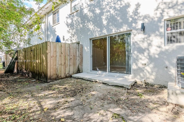 property entrance featuring cooling unit