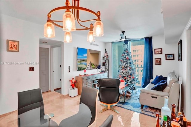 tiled dining space featuring ceiling fan