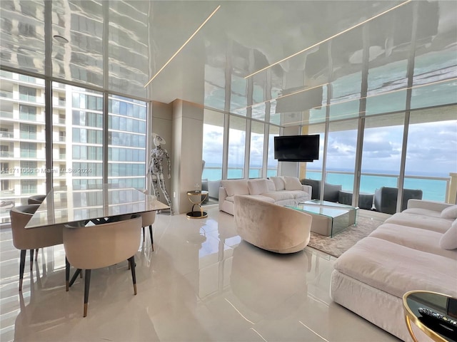 tiled living room featuring floor to ceiling windows and a wealth of natural light