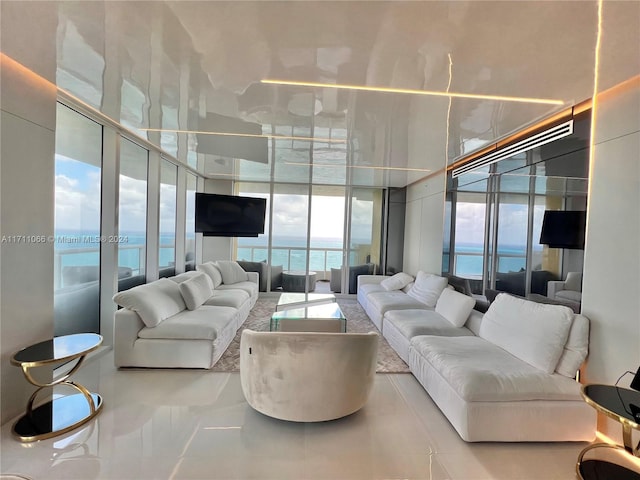 living room featuring floor to ceiling windows and light tile patterned flooring