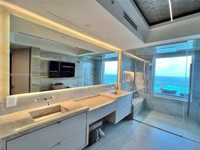 bathroom with vanity, tile patterned floors, and an enclosed shower