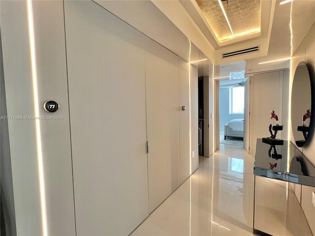 hallway featuring light tile patterned floors