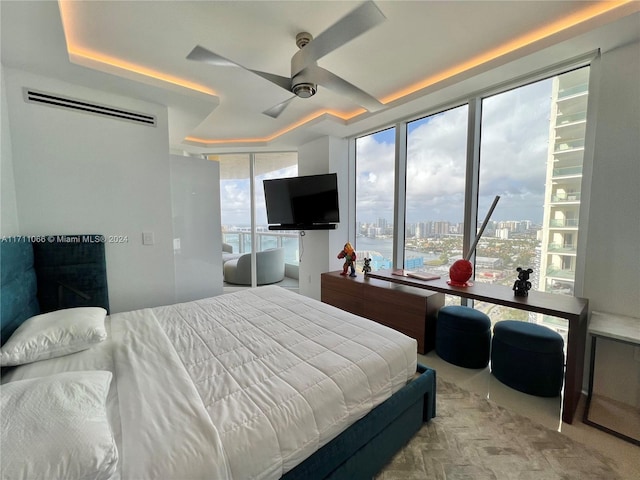 bedroom with multiple windows and ceiling fan