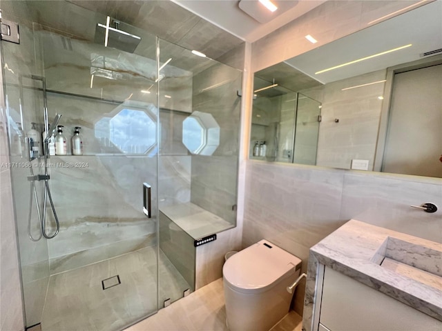 bathroom featuring vanity, an enclosed shower, tile walls, and toilet