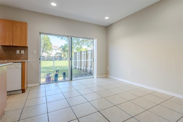 interior space with light tile patterned flooring, recessed lighting, and baseboards