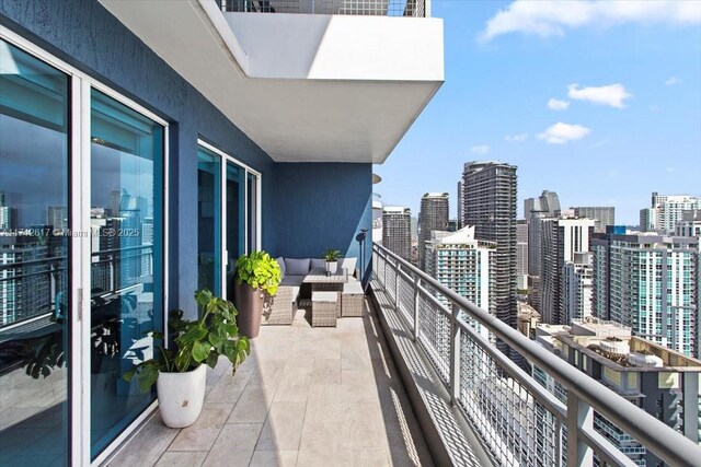 60 SW 13th St Unit 4606, Miami, FL 33130 - balcony featuring a view of skyline and an outdoor hangout area