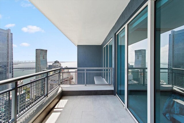 balcony featuring a water view