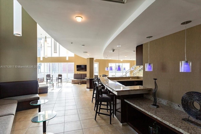 60 SW 13th St Unit 4606, Miami, FL 33130 - bar area featuring healthy amount of natural light, light tile patterned floors, and decorative light fixtures