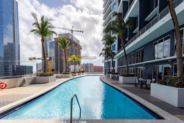 view of pool featuring a patio