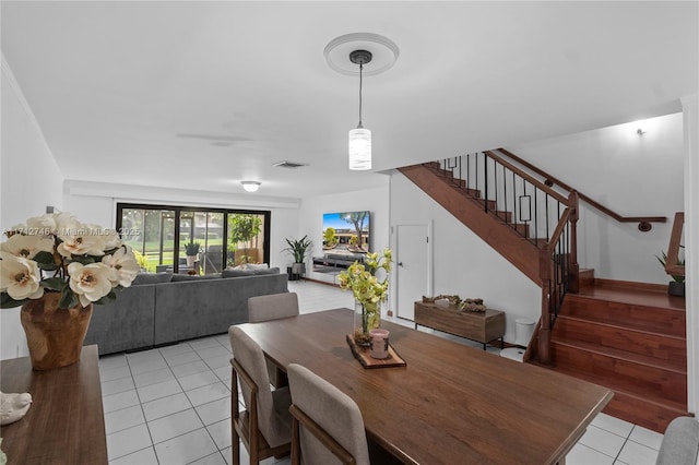 dining area featuring light tile patterned floors