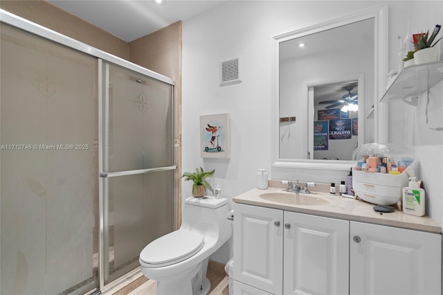 bathroom with vanity, toilet, and walk in shower