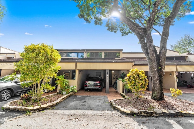 view of front of home featuring a carport