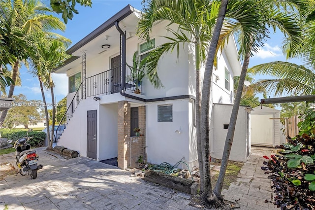 view of side of home with a balcony