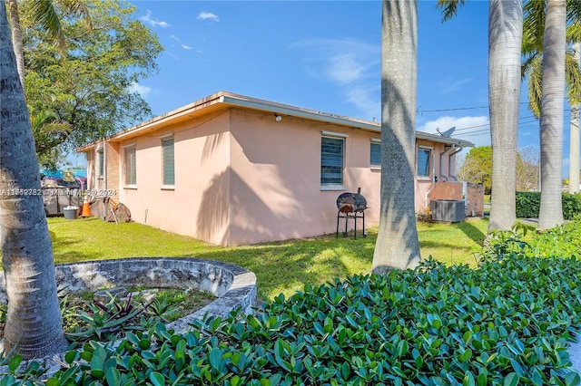 rear view of house with a yard