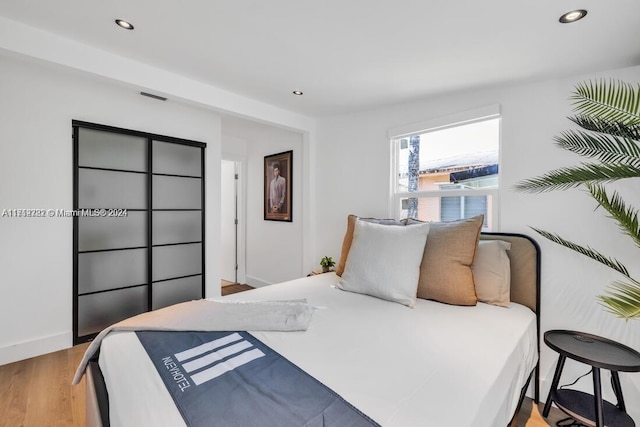 bedroom featuring light hardwood / wood-style floors