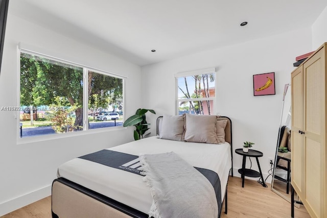 bedroom with light wood-type flooring