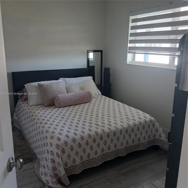 bedroom featuring wood finished floors