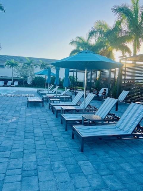 view of patio terrace at dusk