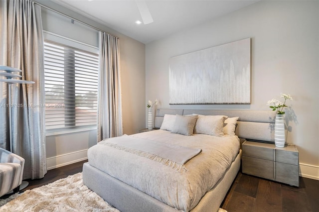 bedroom featuring ceiling fan and dark wood-type flooring