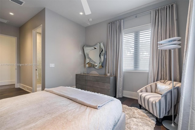 bedroom with ceiling fan and dark wood-type flooring