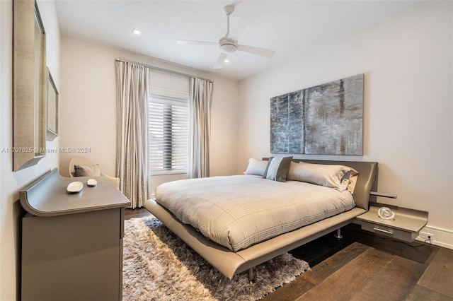 bedroom with ceiling fan and hardwood / wood-style floors