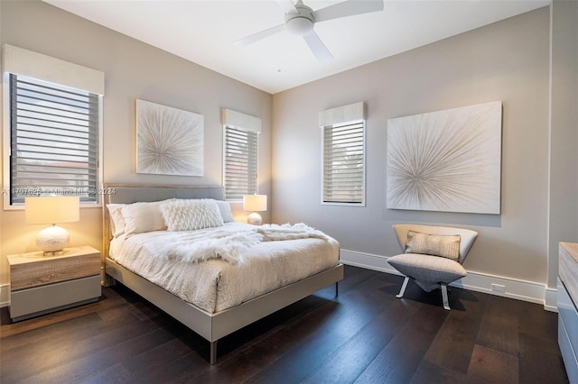 bedroom with ceiling fan and dark wood-type flooring