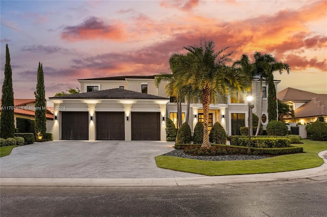 view of front of property with a garage